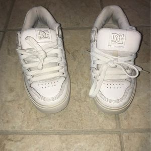 All white Dc sneakers